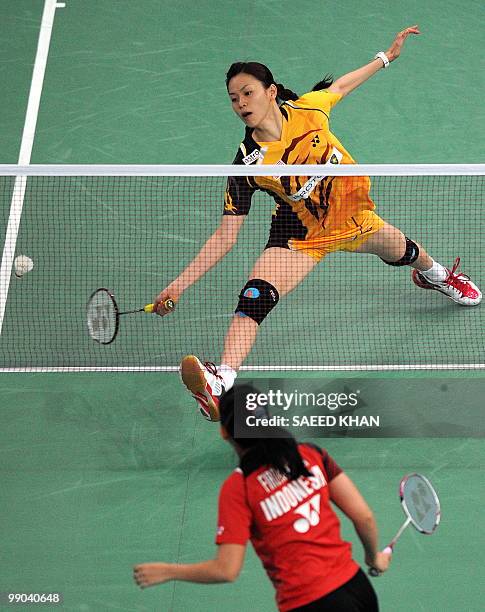Malaysia's Mew Choo Wong plays a shot against Indonesia's Adriyanti Firdasari during the Uber Cup badminton championships in Kuala Lumpur on May...