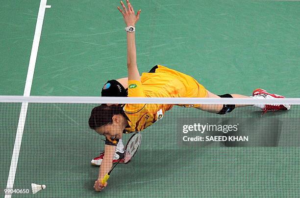 Malaysia's Mew Choo Wong reacts as she fails to collect a drop shot against Indonesia's Adriyanti Firdasari during the Uber Cup badminton...