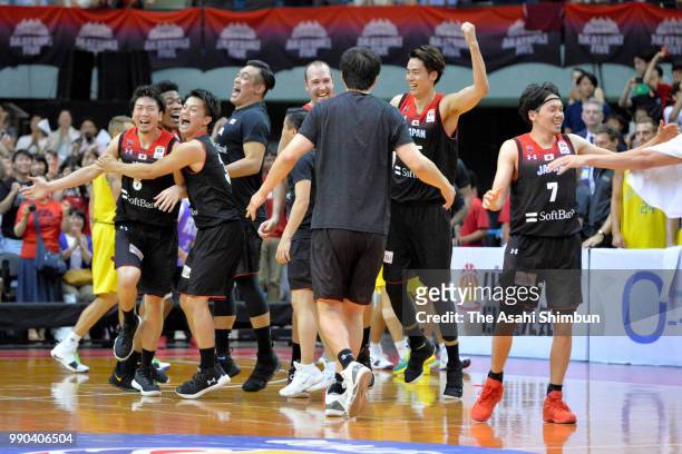 Japanese players celebrate during the FIBA World Cup Asian Qualifier Group B match between Japan and Australia at Chiba Port Arena on June 29, 2018...