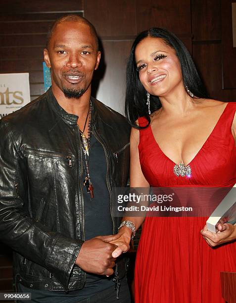 Actors Jamie Foxx and Victoria Rowell attend a signing for Rowell's book "Secrets of a Soap Opera Diva" at Barnes & Noble Booksellers at The Grove on...