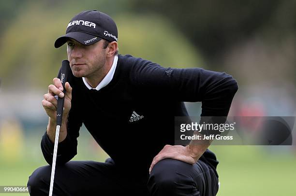 Dustin Johnson lines up a putt during the third round of the Northern Trust Open at Riviera Country Club on February 6, 2010 in Pacific Palisades,...