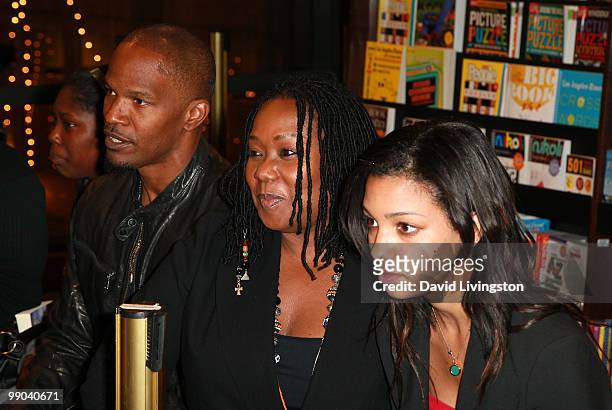 Actor Jamie Foxx and daughter Corinne Foxx attend a signing for Victoria Rowell's book "Secrets of a Soap Opera Diva" at Barnes & Noble Booksellers...