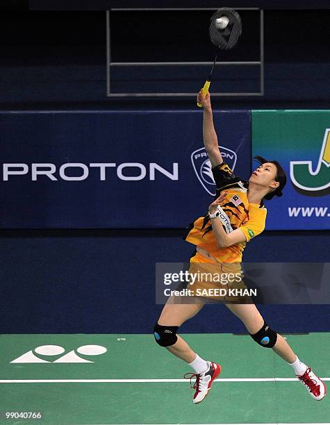 Malaysia's Mew Choo Wong plays a shot against Indonesia's Adriyanti Firdasari during the Uber Cup badminton championships in Kuala Lumpur on May...