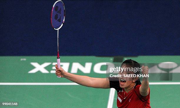 Indonesia's Adriyanti Firdasari celebrates after defeating Malaysia's Mew Choo Wong during the Uber Cup badminton championships in Kuala Lumpur on...