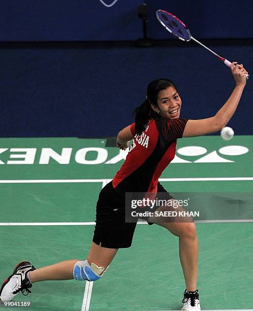 Indonesia's Adriyanti Firdasari plays a shot against Malaysia's Mew Choo Wong during the Uber Cup badminton championships in Kuala Lumpur on May 12,...