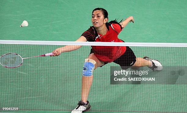 Indonesia's Adriyanti Firdasari plays a shot against Malaysia's Mew Choo Wong during the Uber Cup badminton championships in Kuala Lumpur on May 12,...