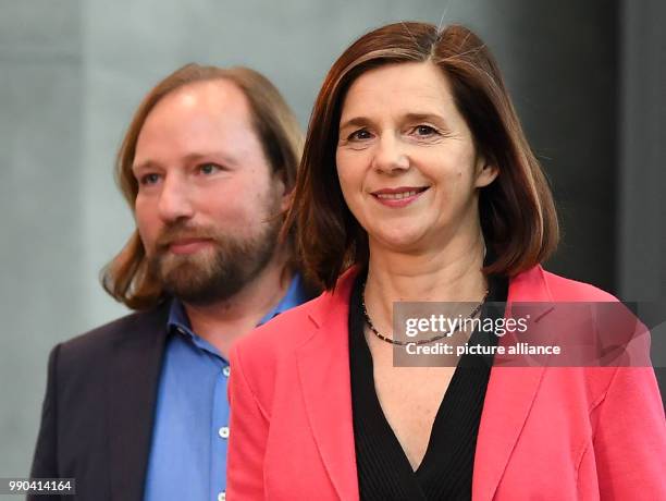 Katrin Goering-Eckardt, re-elected chairman of Alliance 90/The Greens, and fellow politician Anton Hofreiter speak to the media after holding a...