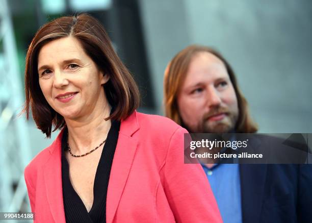 Katrin Goering-Eckardt, re-elected chairman of Alliance 90/The Greens, and fellow politician Anton Hofreiter speak to the media after holding a...