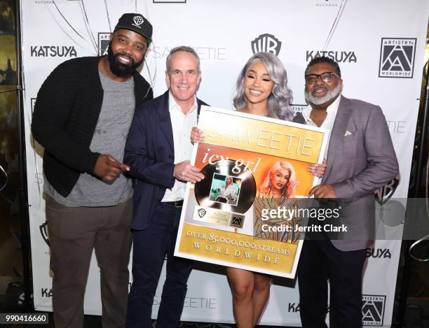Eesean Bolden, VP of A&R at Warner Bros. Records, Warner Bros Records co-chairman Tom Corson, Saweetie and Max Gousse attend Saweetie's Birthday...