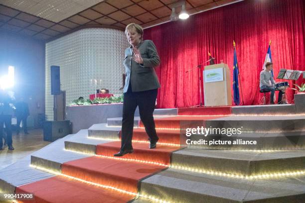 German Chancellor Angela Merkel leaves the stage during the New Year's Reception of the state counsil of the district Vorpommern-Ruegen in...