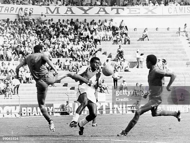 File picture dated June 6, 1970 shows Moroccan defender Khanousi Moulay Idriss and Peruvian forward Teofilo Cubillas competing during the World Cup...