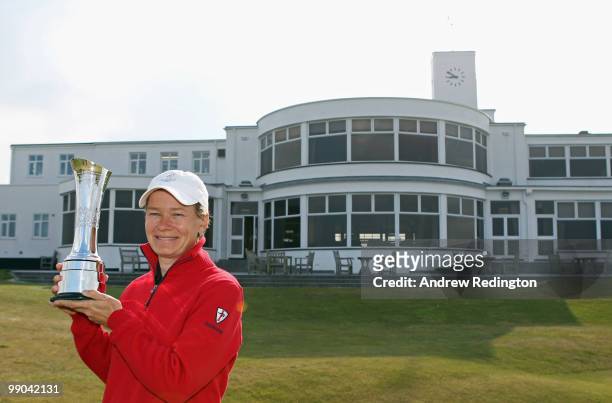 Catriona Matthew of Scotland, the defending champion, poses with the trophy during the 2010 Ricoh Women's British Open Media Day at Royal Birkdale on...