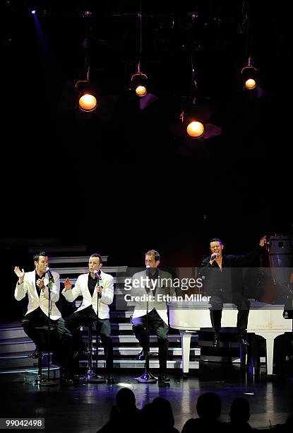 Australian vocal group Human Nature Phil Burton, Andrew Tierney, Toby Allen and Michael Tierney perform after announcing a two-year extension of...