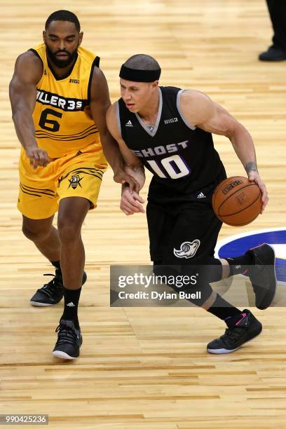 Mike Bibby of Ghost Ballers is guarded by Alan Anderson of Killer 3s during week two of the BIG3 three on three basketball league at United Center on...