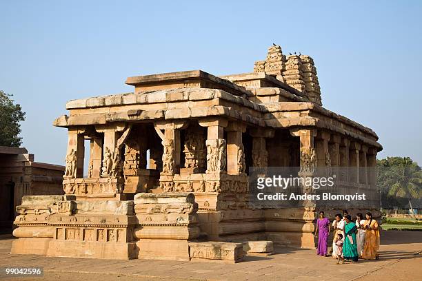 women walking by the 7th century durga temple - circa 7th century stock pictures, royalty-free photos & images