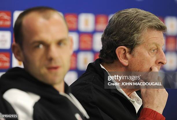 Fulham's English midfielder Danny Murphy and Fulham's head coach Roy Hodgson address a press conference on May 11, 2010 in Hamburg, northern Germany,...
