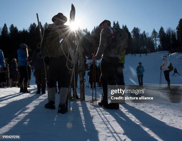 Equipped with wooden skis and wearing traditional clothing, skiers prepare for a nostalgic ski race in Kruen, Germany, 13 January 2018. Photo:...