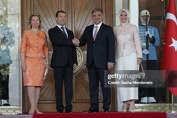 Russian President Dmitry Medvedev and Turkish President Abdullah Gul shake hands next to their wifes Svetlana Medvedeva and Hayrunnisa Gul at the...