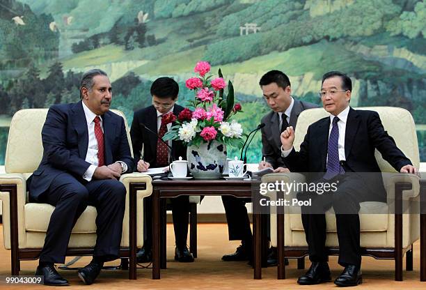 China's Premier Wen Jiabao talks with Qatar's Prime Minister Sheikh Hamad Bin Jassim Bin Jabr Al-Thani during a meeting at the Great Hall of the...