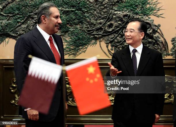 China's Premier Wen Jiabao talks with Qatar's Prime Minister Sheikh Hamad Bin Jassim Bin Jabr Al-Thani during a meeting at the Great Hall of the...