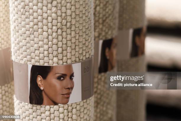 Portraits of designer Barbara Becker can be seen on the products of her new collection at Domotex in Hanover, Germany, 13 January 2018. Domotex is a...