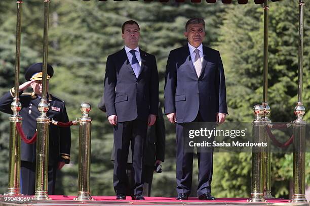 Russian President Dmitry Medvedev and Turkish President Abdullah Gul review a guard of honour at the presidential palace on May 12, 2010 in Ankara,...