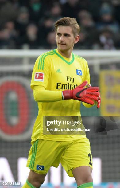 Goalie Julian Pollersbeck of Hamburg on his way to goal during the German Bundesliga football match between FC Augsburg and Hamburger SV at the...