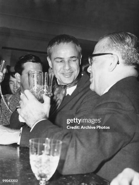 American actor Marlon Brando at a bar, circa 1960.