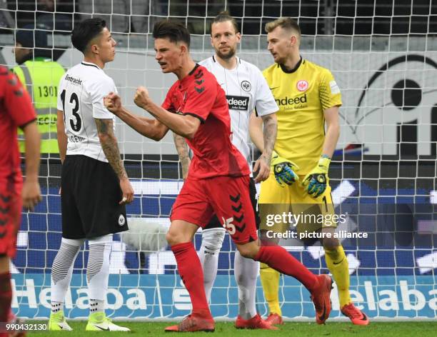 Freiburg goalscorer Robin Koch celebrates after the goal for 1:1 beside Frankfurt's Carlos Salcedo , Marco Russ and goalie Lukas Hradecky during the...