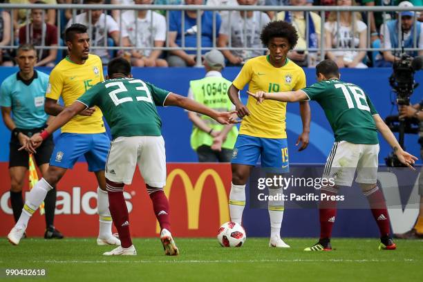 Mehdi Carcela and Amine Harit from Morocco, Paulo Henrique Sampaio Filho and Willian Borges da Silva from Brazil during a match between Brazil and...