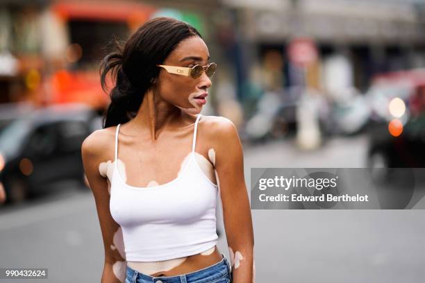 Winnie Harlow , outside Schiaparelli, during Paris Fashion Week Haute Couture Fall Winter 2018/2019, on July 2, 2018 in Paris, France.