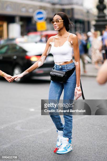 Winnie Harlow , outside Schiaparelli, during Paris Fashion Week Haute Couture Fall Winter 2018/2019, on July 2, 2018 in Paris, France.