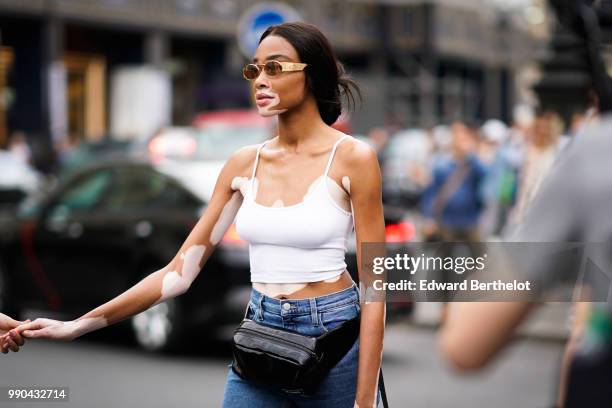 Winnie Harlow , outside Schiaparelli, during Paris Fashion Week Haute Couture Fall Winter 2018/2019, on July 2, 2018 in Paris, France.