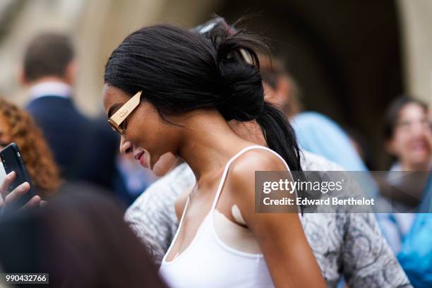 Winnie Harlow , outside Schiaparelli, during Paris Fashion Week Haute Couture Fall Winter 2018/2019, on July 2, 2018 in Paris, France.