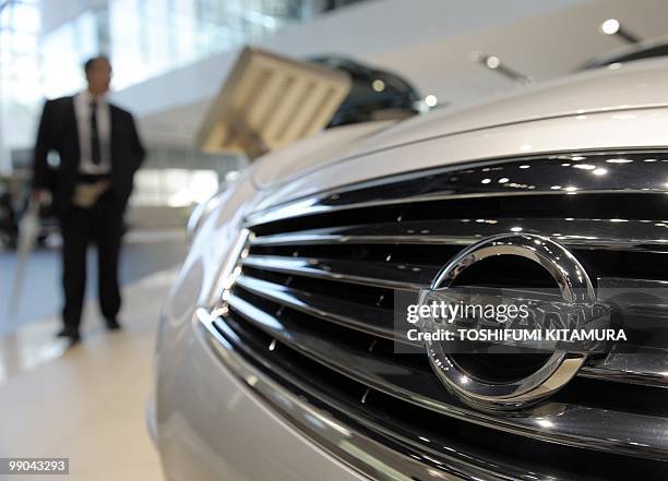 Visitor looks at Nissan Skyline at the showroom in its headquarters in Yokohama, on May 12, 2010. Nissan Motor posted a return to the black and...