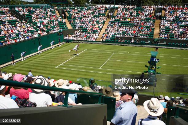 Marin Cilic of Croatia serves against Yoshihito Nishioka of Japan in the first round of the 2018 Wimbledon Championships at the All England Club in...