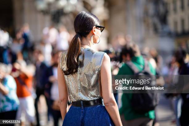 Giovanna Battaglia wears a silver sleeveless top, a blue skirt , outside Schiaparelli, during Paris Fashion Week Haute Couture Fall Winter 2018/2019,...