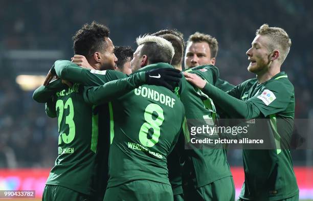 Bremen's Max Kruse, Jerome Gondorf, Ludwig Augustinsson and Florian Kainz celebrate with the goalscorer for 1:1 Theodor Gebre Selassie during the...