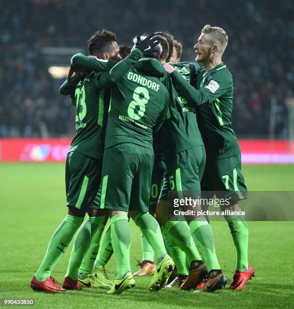 Bremen's Max Kruse, Jerome Gondorf, Ludwig Augustinsson and Florian Kainz celebrate with the goalscorer for 1:1 Theodor Gebre Selassie during the...