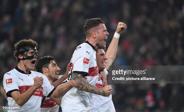 Stuttgart's Mario Gomez , Daniel Ginczek, Berkay Ozcan and Benjamin Pavard celebrate after a goal during the German Bundesliga football match between...
