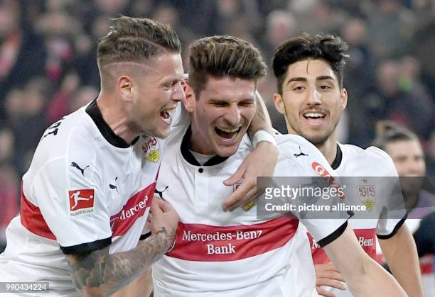Stuttgart's Mario Gomez , Daniel Ginczek and Berkay Ozcan celebrate their side's 1st goal during the German Bundesliga soccer match between VfB...