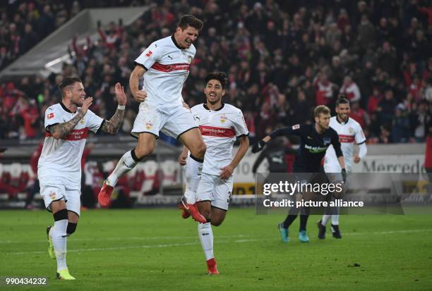 Stuttgart's Mario Gomez , Daniel Ginczek and Berkay Ozcan celebrate their side's 1st goal during the German Bundesliga soccer match between VfB...