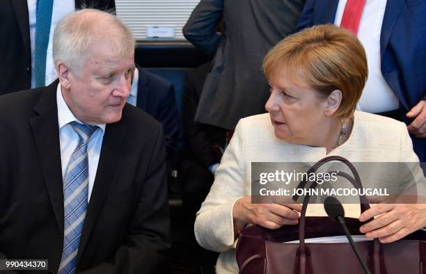 German Chancellor and leader of the Christian Democratic Union Angela Merkel and German Interior Minister and leader of the Bavarian Christian Social...