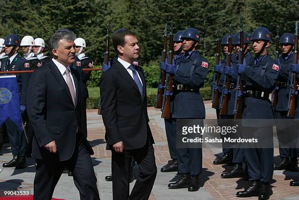 Russian President Dmitry Medvedev and Turkish President Abdullah Gul review a guard of honour at the presidential palace on May 12, 2010 in Ankara,...