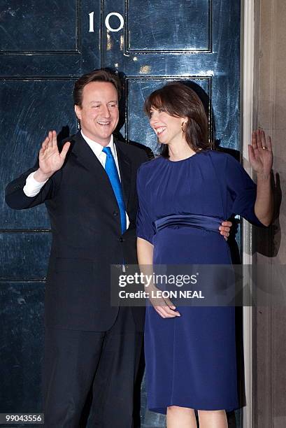 Britain's new Prime Minister David Cameron and his wife Samantha, pose for pictures outside 10 Downing Street in London, on May 11, 2010. David...