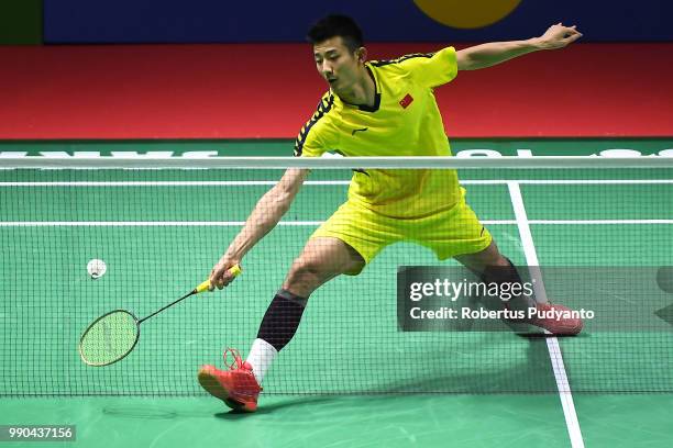 Chen Long of China competes against Brice Leverdez of France during the Men's Singles Round 1 match on day one of the Blibli Indonesia Open at Istora...