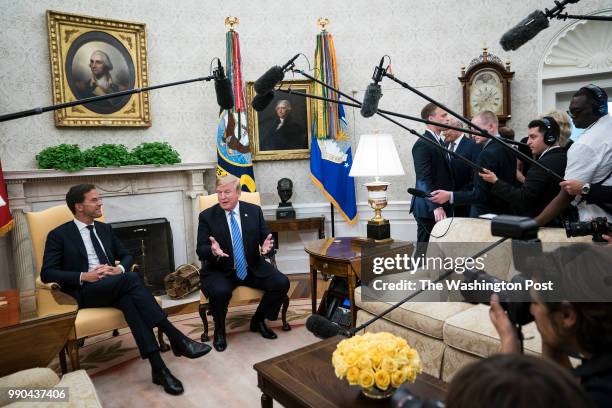 President Donald J. Trump speaks with Mark Rutte, Prime Minister of the Netherlands, during a meeting in the Oval Office of the White House on...