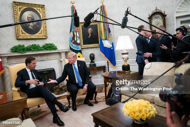 President Donald J. Trump shakes hands with Mark Rutte, Prime Minister of the Netherlands, during a meeting in the Oval Office of the White House on...