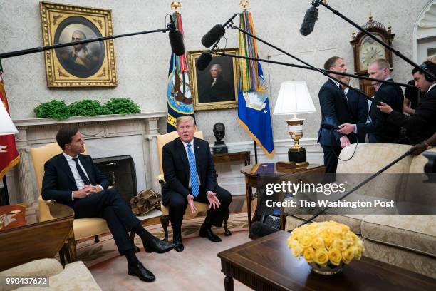 President Donald J. Trump speaks with Mark Rutte, Prime Minister of the Netherlands, during a meeting in the Oval Office of the White House on...