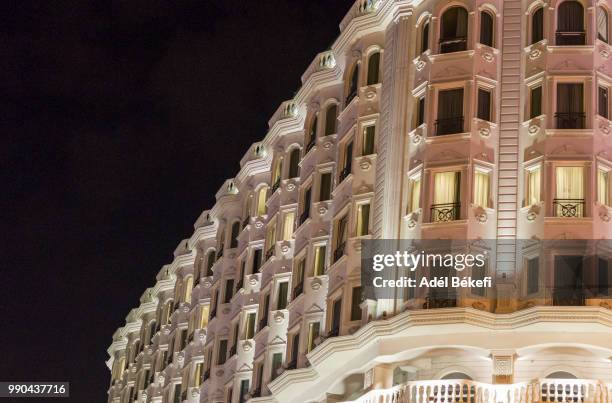 low angle wiev of hotel in the night - bad part of town stock pictures, royalty-free photos & images